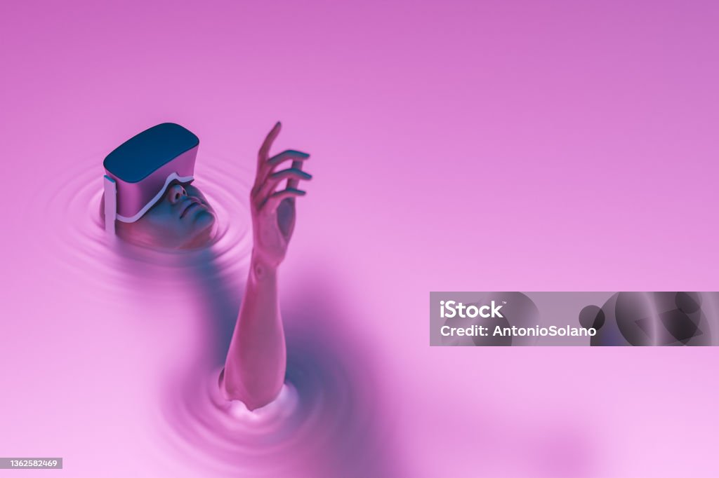 surreal girl with VR glasses immersed in liquid surrealistic scene of a girl with VR glasses immersed in liquid with neon lighting. metaverse concept, nft, creative art and technology. 3d rendering. fictional character Metaverse Stock Photo