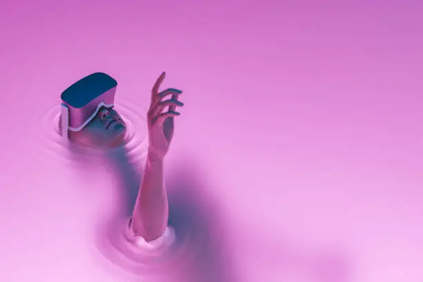 Photo of surreal girl with VR glasses immersed in liquid