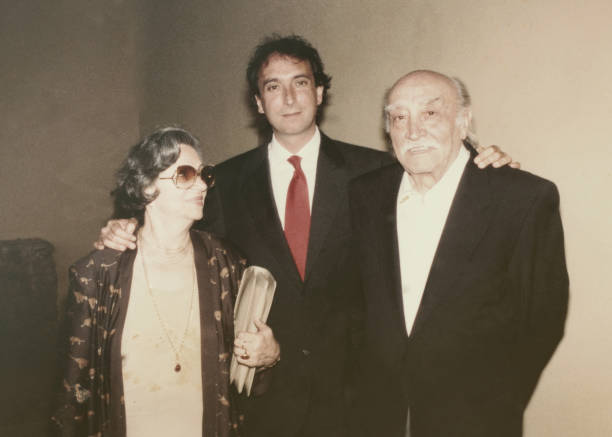 istock Young groom with his parents in 1968. 1362584274