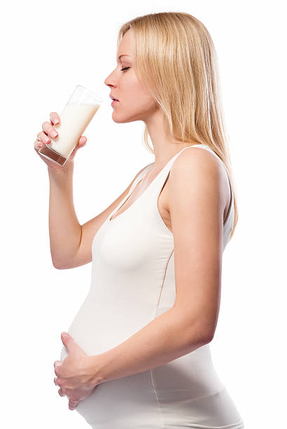 istock Pregnant woman drinking milk 136258523