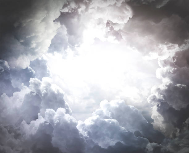 Beautiful background of cumulus clouds. A hole in the dramatic clouds. Copy space. Beautiful background of cumulus clouds. A hole in the dramatic clouds. Copy space. Armageddon Bible stock pictures, royalty-free photos & images