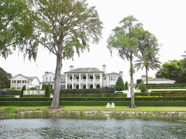 Winter Park, Florida, USA - March 20, 2021: Beautiful home and garden in the Chain of Lakes as seen from a scenic boat tour.