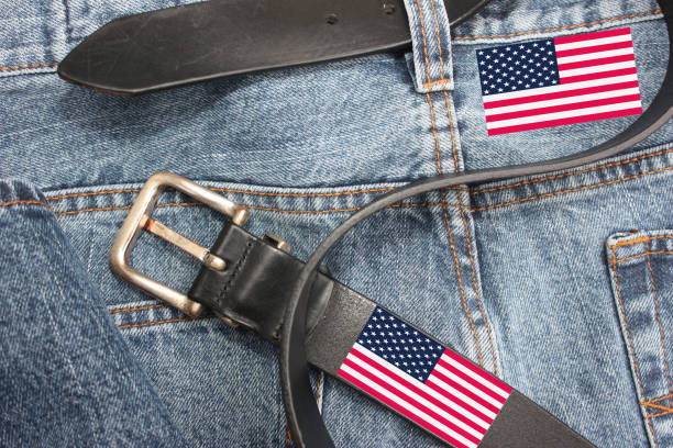 Jeans pants with leather belt decorated with the American flag Jeans pants with leather belt decorated with the American flag straight leg pants stock pictures, royalty-free photos & images