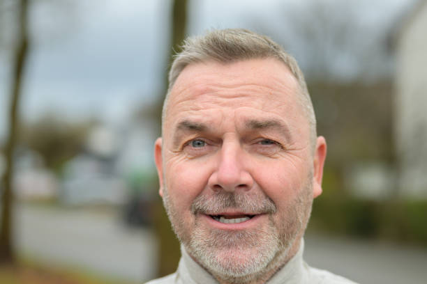 istock Middle-aged man winking at camera with a cheesy grin 1362589269