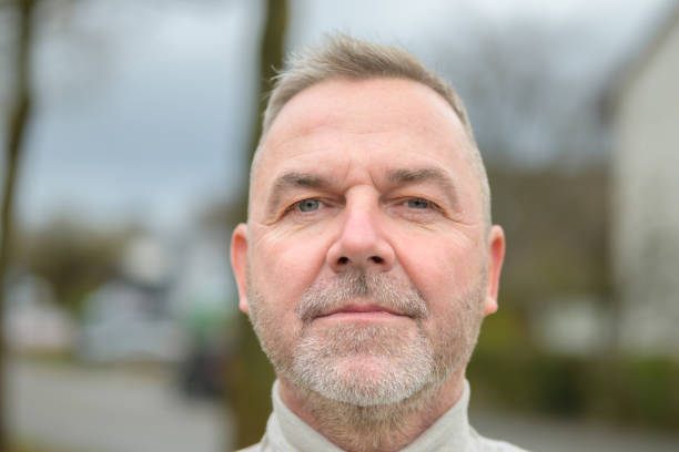 istock Middle-aged man staring thoughtfully at the camera 1362590378