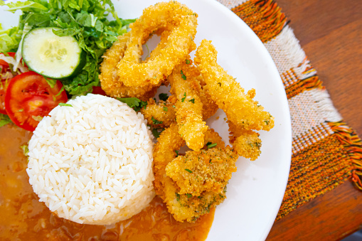 Lula a dorê - fried squid - with rice, beans and salad - brazilian seafood