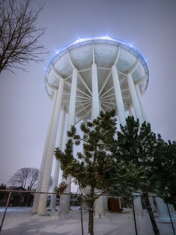 A water tower in Windsor, Ontario, illuminated at night