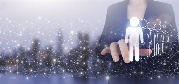 istock Business communication concept. Marketing. Teamwork. Hand touch digital screen hologram Human, Leader sign on city light blurred background. Recruitment Employment Headhunting Concept. 1362593152