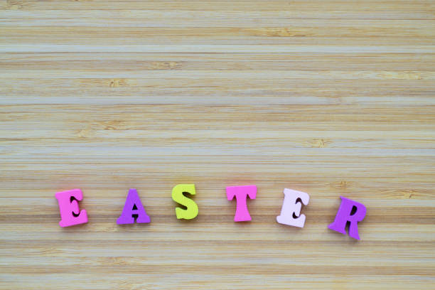 istock Inscription Easter made from small wooden, multi colored letters. 1362598306