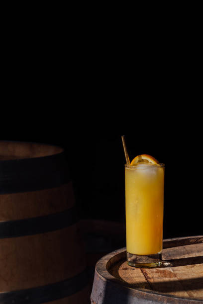 istock orange juice drink in tall glass with ice and straw 1362600549