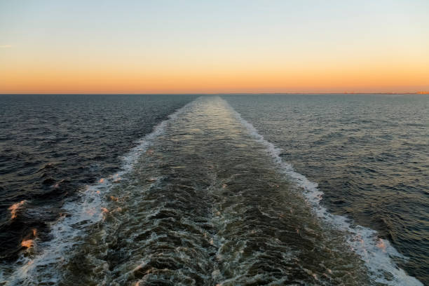 istock Water wake of the ferry left on sea surface 1362600982