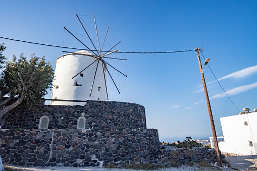 Traditional Windmill near Pyrgos Kallistis on Santorini, Greece. This is used as private accommodation.
