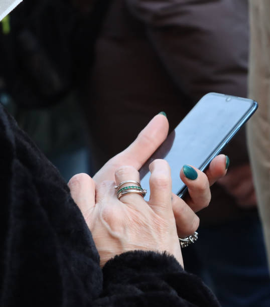 istock female hands with mobile phone - 1362603180
