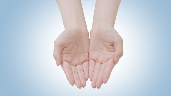 Female beauty hands showing palms top view in giving or receiving gesture. Isolated clean background showing holding or offering pose revealing product showcase and copy space. Young woman white Skin.