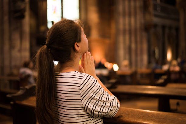 istock Religious woman praying 1362604104