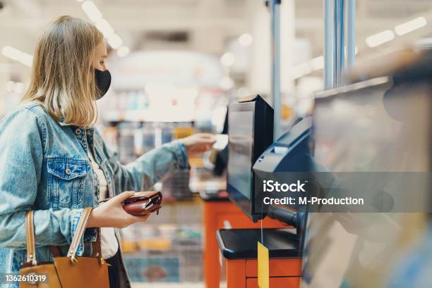 Woman In Medical Mask Pays At Selfcheckouts Stock Photo - Download Image Now - 35-39 Years, Adult, Adults Only