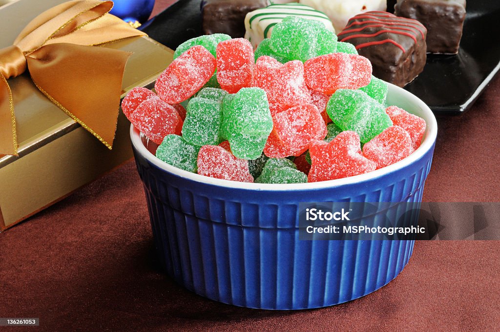 Christmas Candy Star shaped gumdrops and petit fours with Christmas gifts Christmas Stock Photo