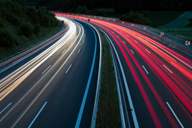 istock Car Light Trails on Highway at Night 1362611078
