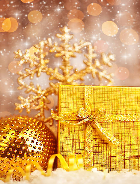 istock Golden Christmas gift with baubles decorations 136261231