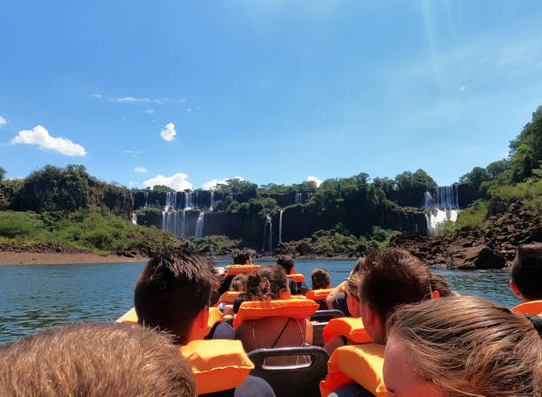 Boat trip on the Iguaçu River with the waterfalls in Argentina. stock photo