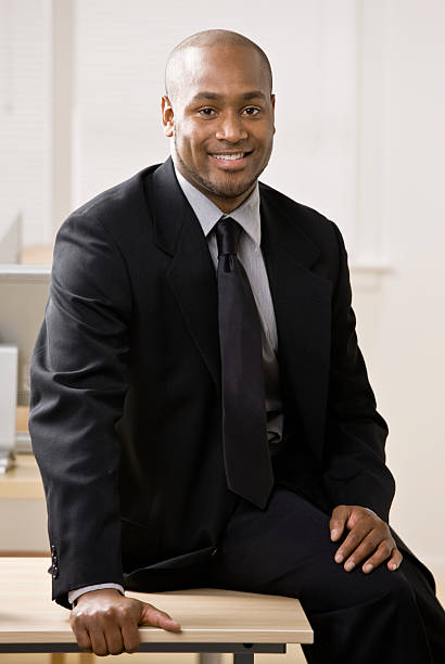 istock Confident businessman sitting on desk 136261506