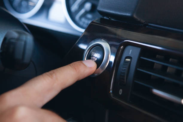 istock a man presses the start button in the car 1362615303