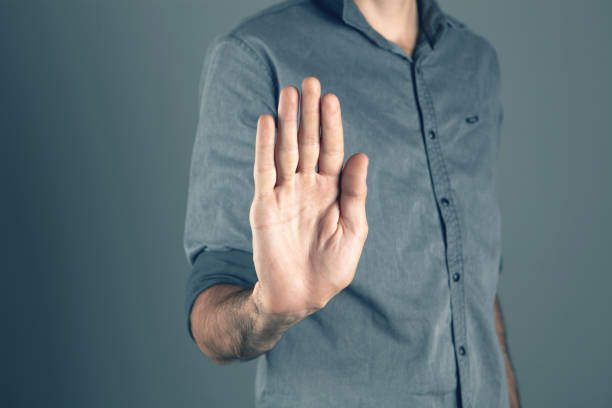 istock man showing stop with his hand 1362615372