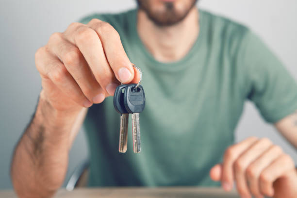 istock man holding house keys 1362615401