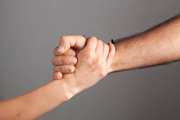 istock man and woman shake hands 1362615590