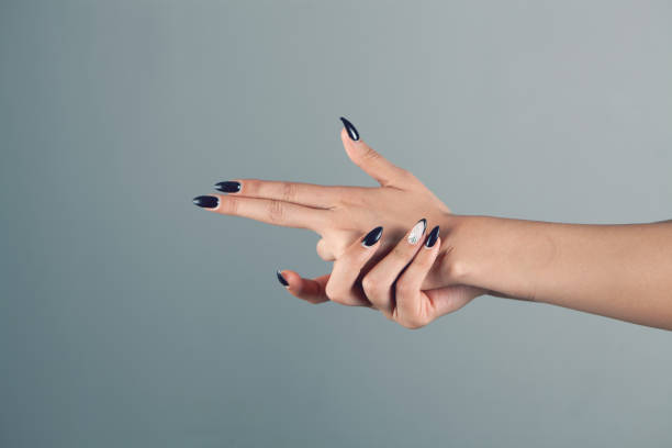 istock woman hands making gun aiming gesture 1362615609