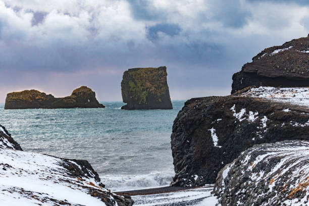 istock Black Basalt Rocks off of Reynisfjara 1362617067
