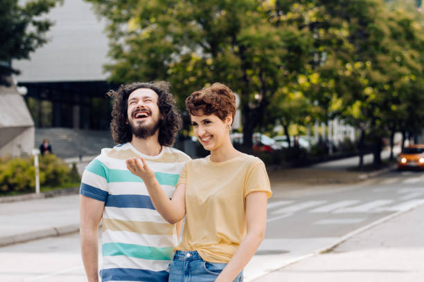 istock Happy couple walking and flirting 1362617166