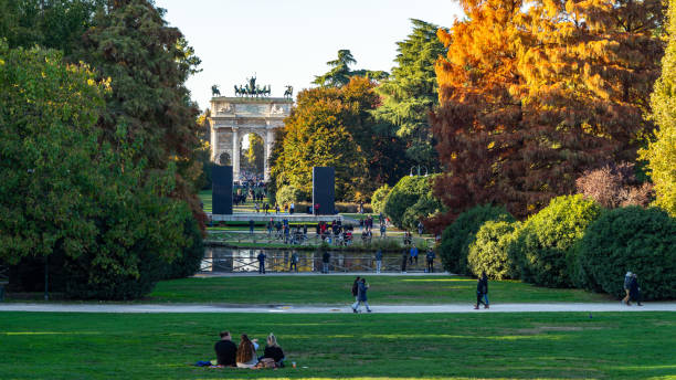 View of Parco Sempione, the largest park in Milan during autumn season, Italy View of Parco Sempione, the largest park in Milan during autumn season. Milan, Italy, Nov. 2021 pool gate stock pictures, royalty-free photos & images