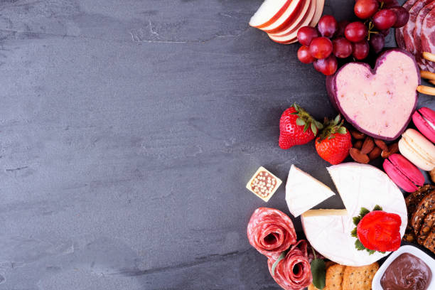 istock Valentines Day charcuterie side border on a slate background 1362619267