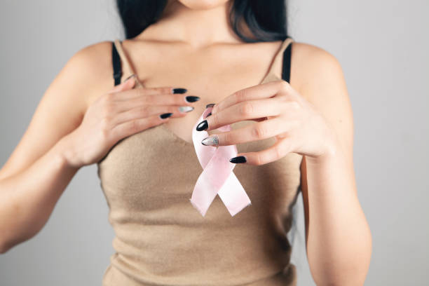 istock woman holding pink ribbon 1362620792