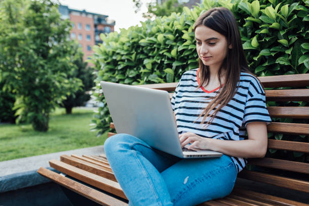 istock Portrait of a beautiful student learning outside 1362620981