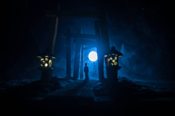 istock Creative artwork decoration. Abstract Japanese style wooden tunnel at night. Selective focus 1362625352
