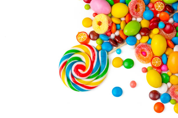 istock Colorful lollipops and different colored round candy. Top view. 1362625785