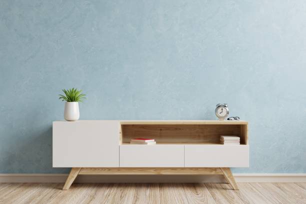 istock Living room interior with cabinet on empty blue wall background. 1362633700