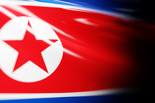 3D illustration of the national waving flag of North Korea. Country symbol.