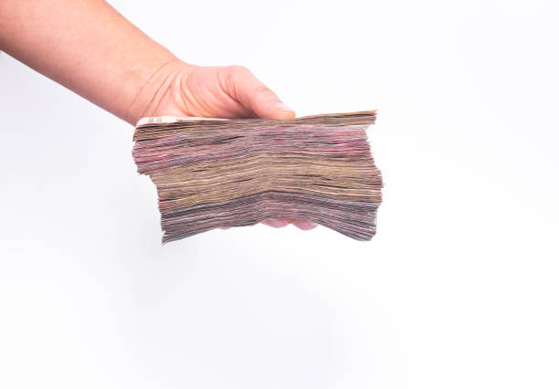 istock a large stack of paper money in a woman's hand 1362637686