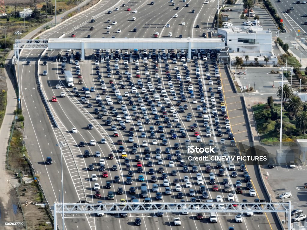 Aerial View of Traffic at Bay Bridge Toll Plaza Traffic congestion at the San Francisco Oakland Bay Bridge toll plaza in Oakland, California. Toll Booth Stock Photo