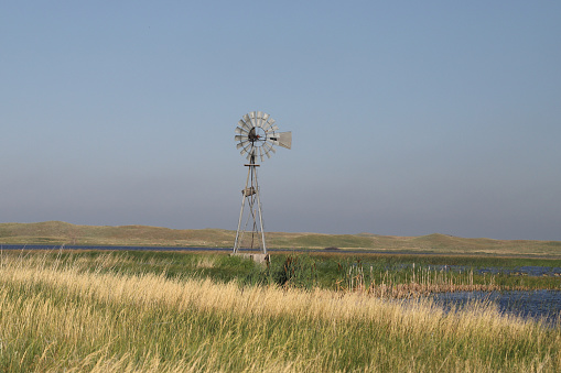 Windmill beside a pond at Crescent Lake National Wildlife Refuge, Nebraska