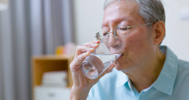 istock man takes vitamin or medicine 1362641658