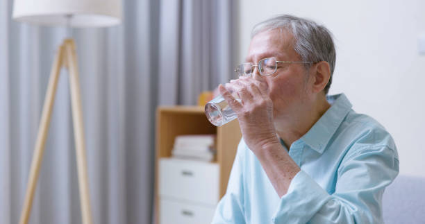 istock man takes vitamin or medicine 1362641660