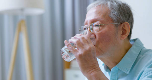 istock man takes vitamin or medicine 1362641682