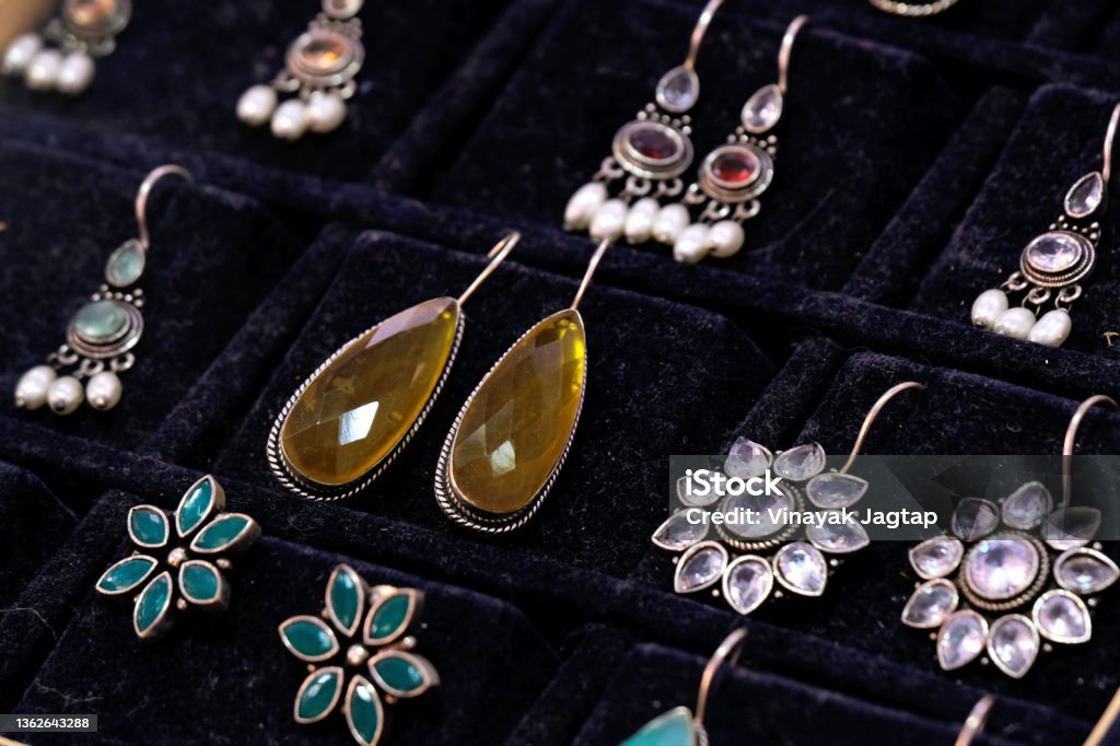 Indian Traditional jewellery displayed in a street shop for sale in Pune, Maharashtra. Indian art, Indian Traditional jewelry. Earring Stock Photo
