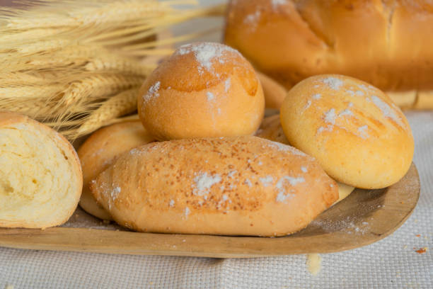 istock Baked breads on wooden table background. 1362644108