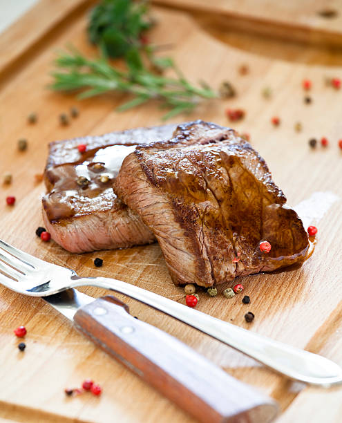 istock Steaks On a Wooden Board 136265217