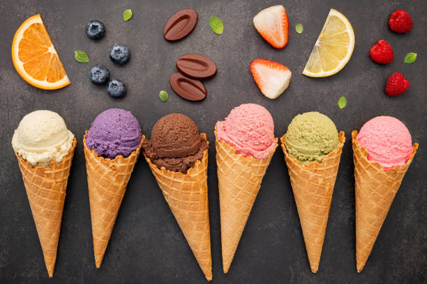 istock Flat lay ice cream cones collection on dark stone background . Blank crispy ice cream cone with copy space for sweets menu design. 1362655781